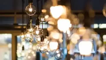 up close view of an array of modern light fixtures hanging from the ceiling